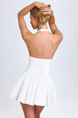 Mini-robe plissée dos nu en blanc