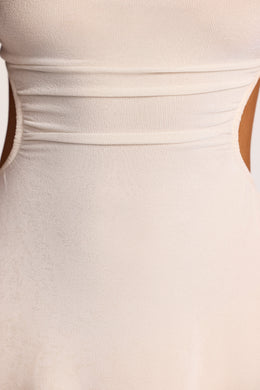 Mini-robe en jersey texturé à col montant et ourlet mouchoir en ivoire