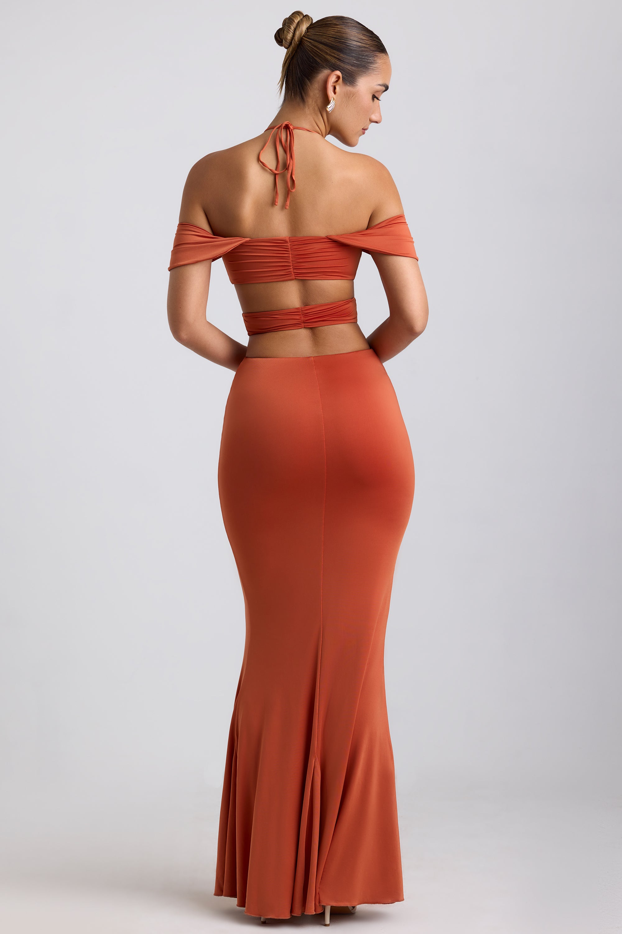 Robe dos nu découpée en jersey moulant en orange brûlé