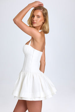 Mini-robe froncée dos nu en blanc