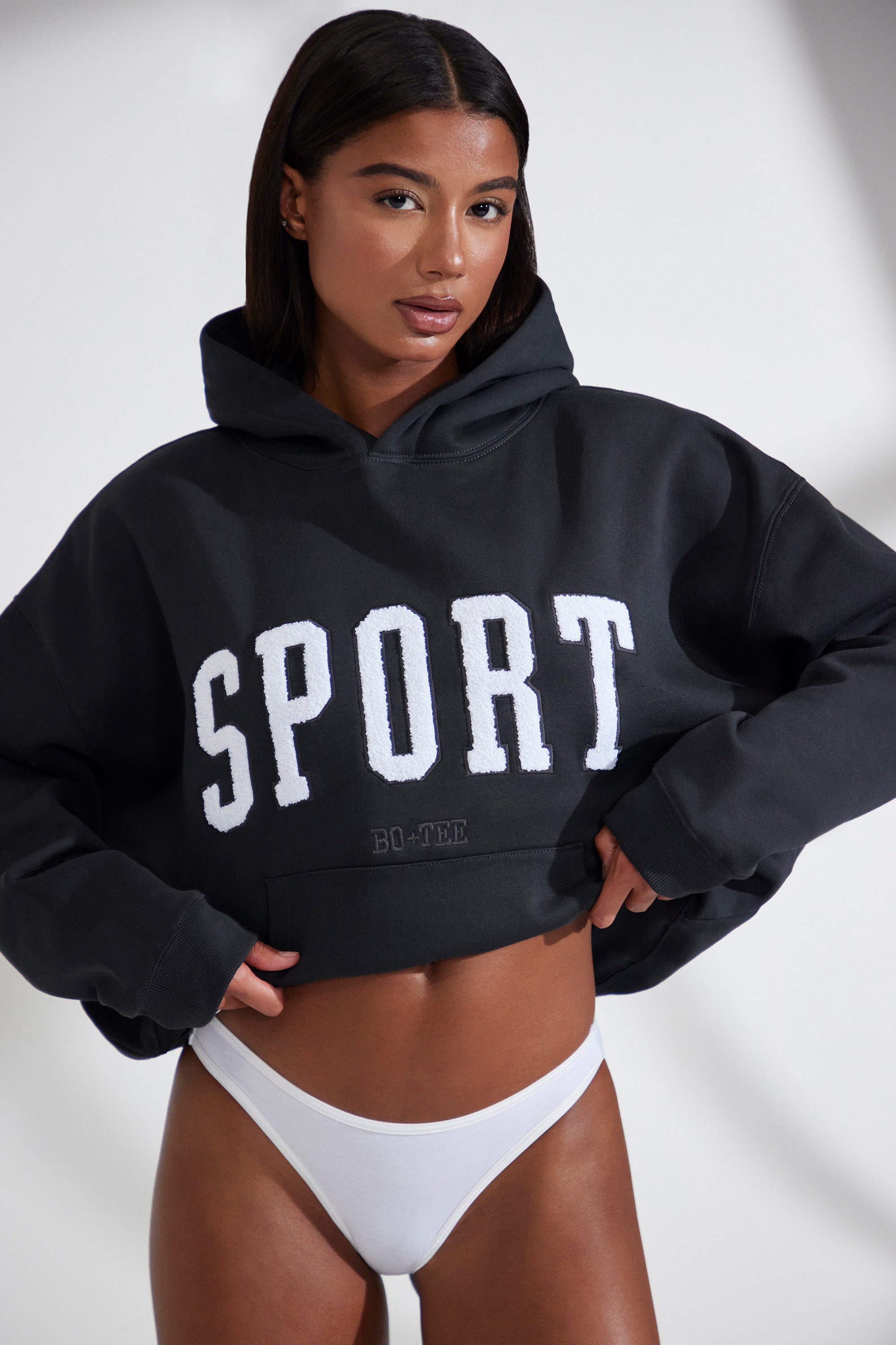 Varsity Oversized Hooded Sweatshirt in Black Oh Polly