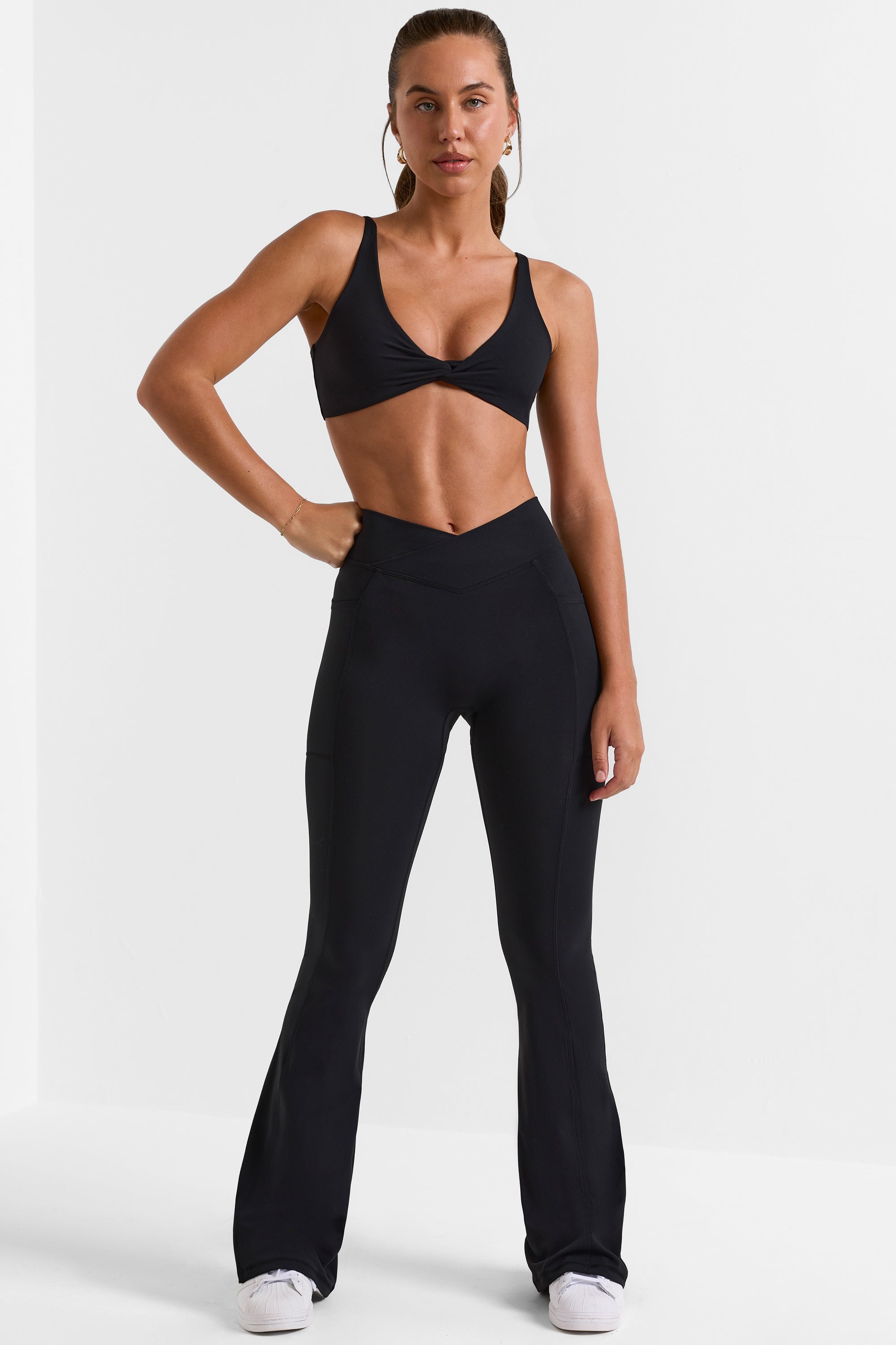 Petite Cross Waistband Flare Pocket Leggings in Black