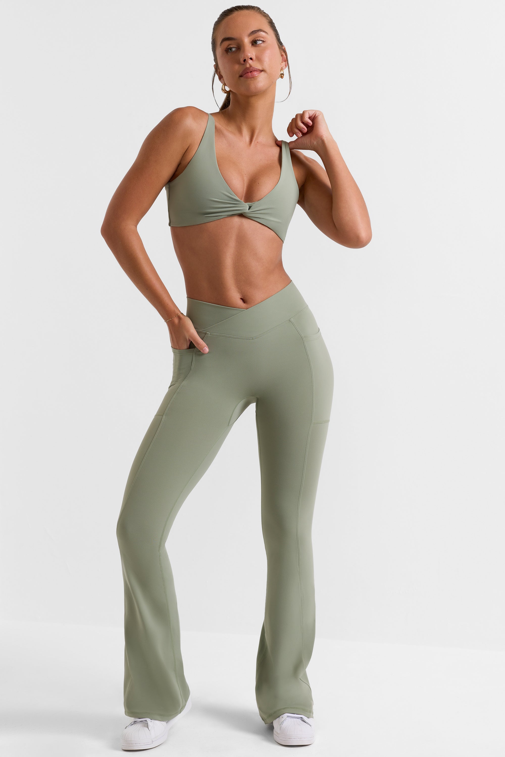 Cross Waistband Flare Pocket Leggings in Bamboo Green