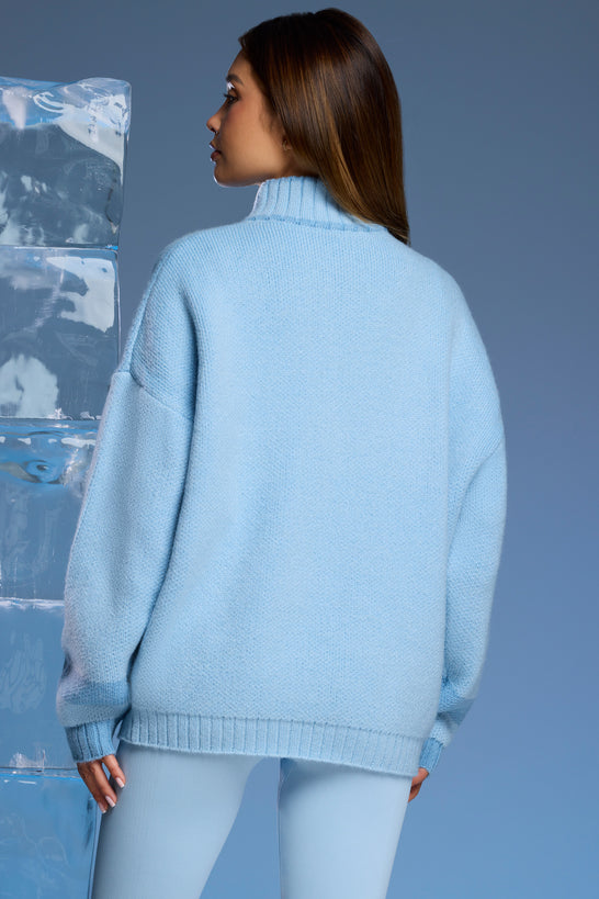 Oversize'owy sweter z grubej dzianiny zapinany na zamek w kolorze Baby Blue