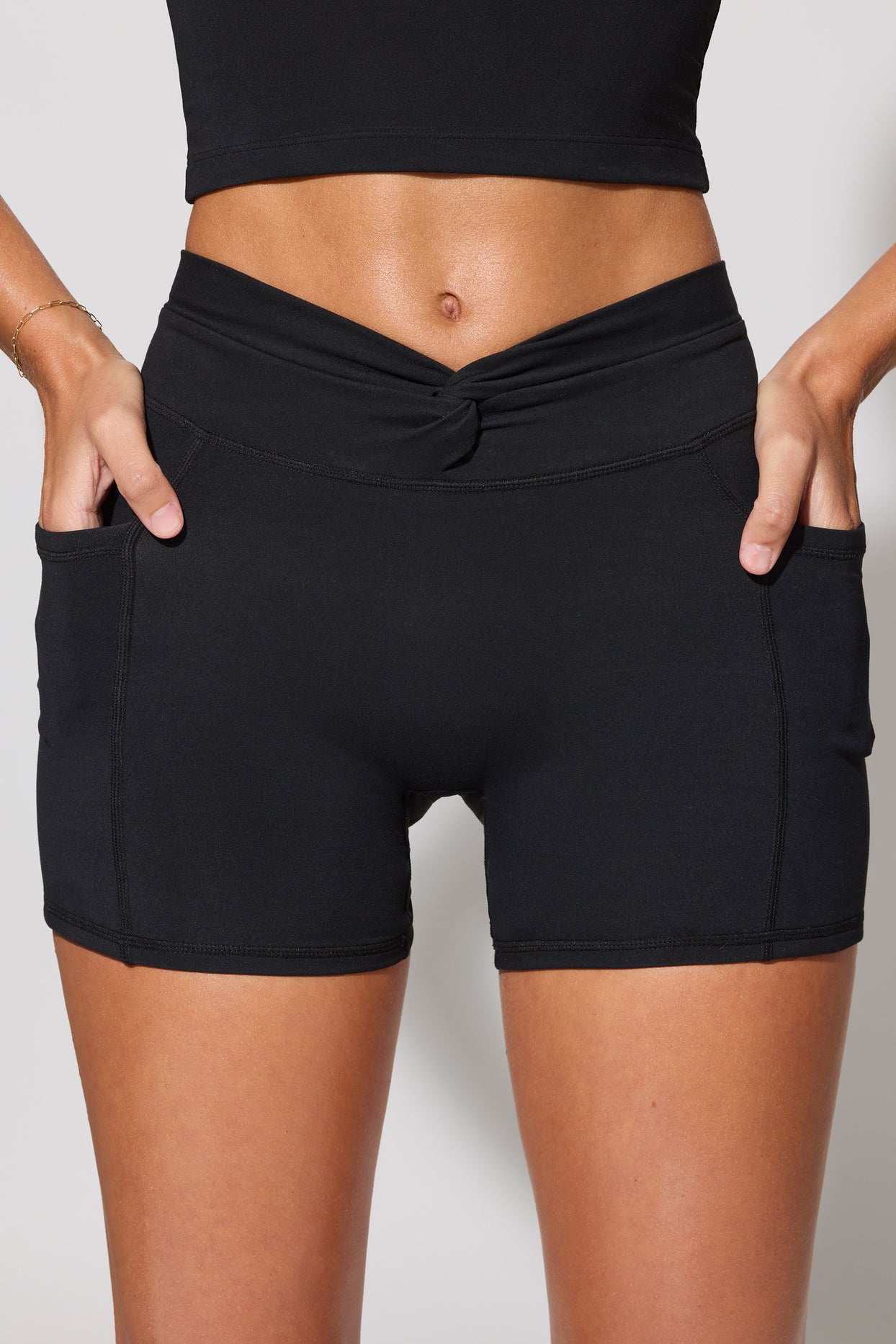 Shift Twist Waist Mini Shorts with Pockets in Black | Oh Polly