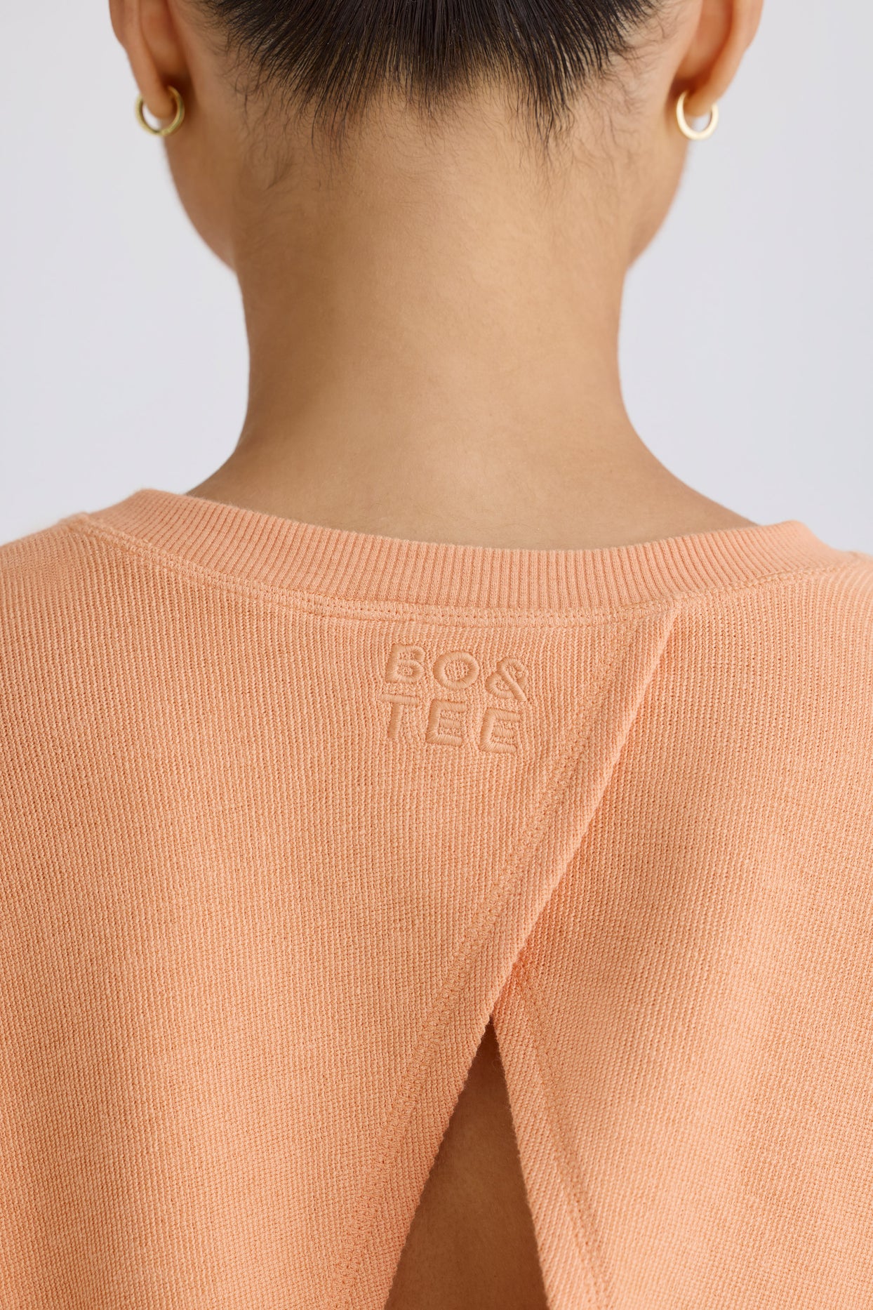 Crew-Neck Open-Back Cropped Sweatshirt in Peach