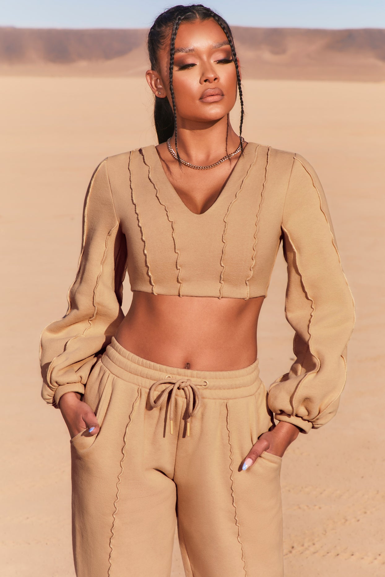 https://www.ohpolly.com/cdn/shop/products/3740_2_uncovered-beige-exposed-seam-v-neck-balloon-sleeve-crop-top.jpg?v=1645126412&width=1244